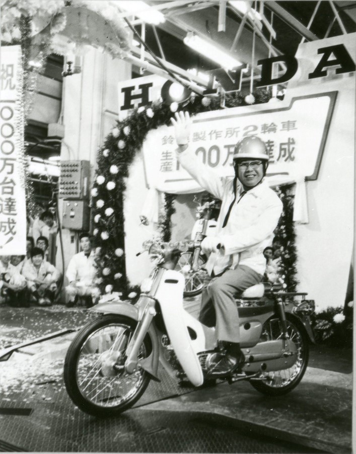 Founder, Soichiro Honda on a Super Cub (at Memorial Ceremony in 1971 of cumulative production of motorcycles reached 10 million unit milestone at Suzuka Factory)